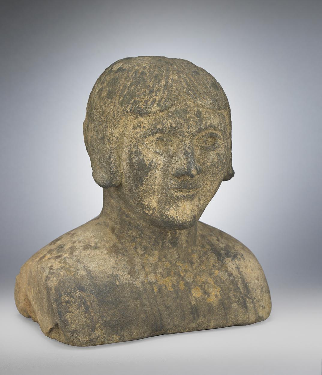 A Distinctive Primitive Carved Stone Portrait Bust