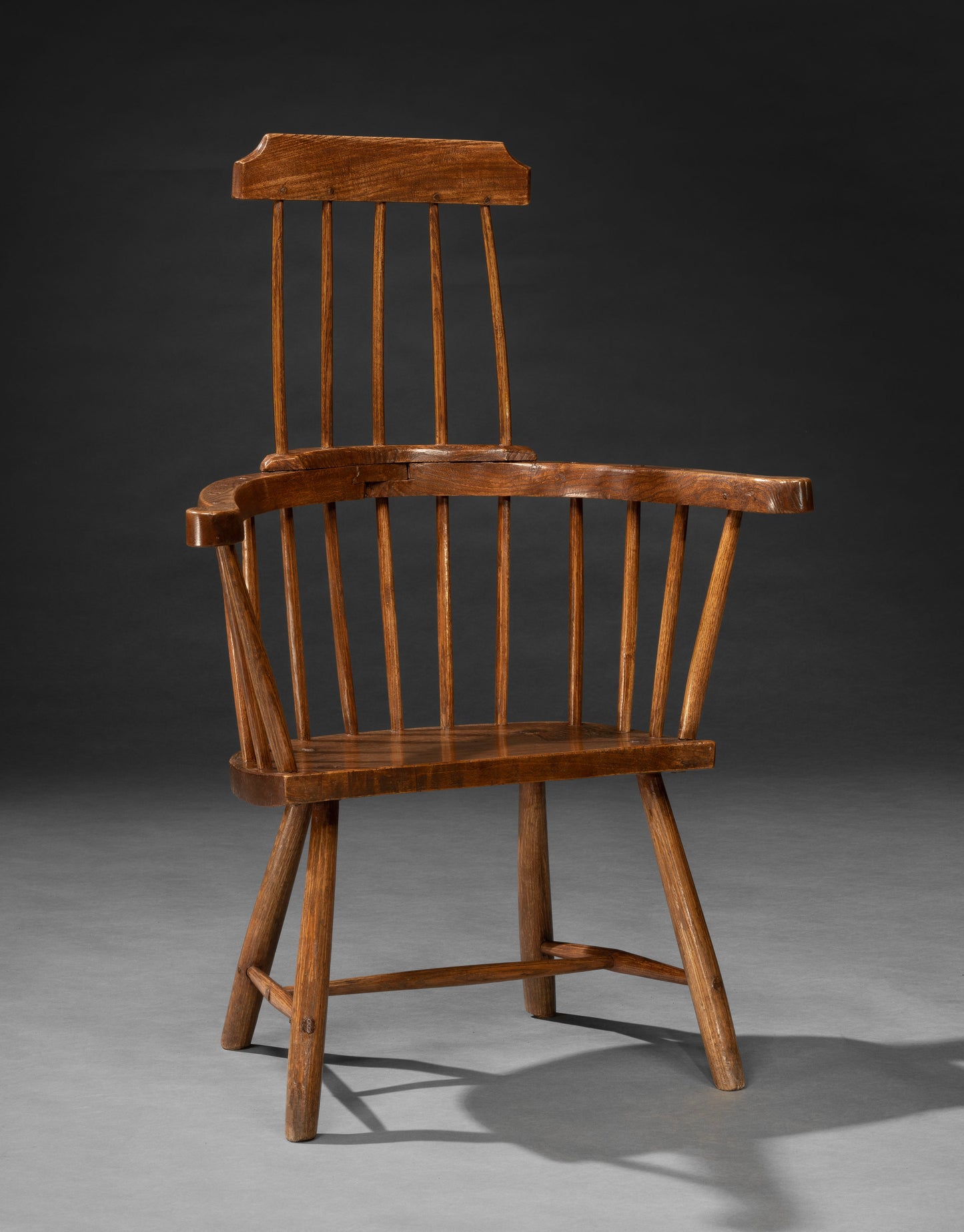 Singular Primitive Windsor Comb Back Armchair