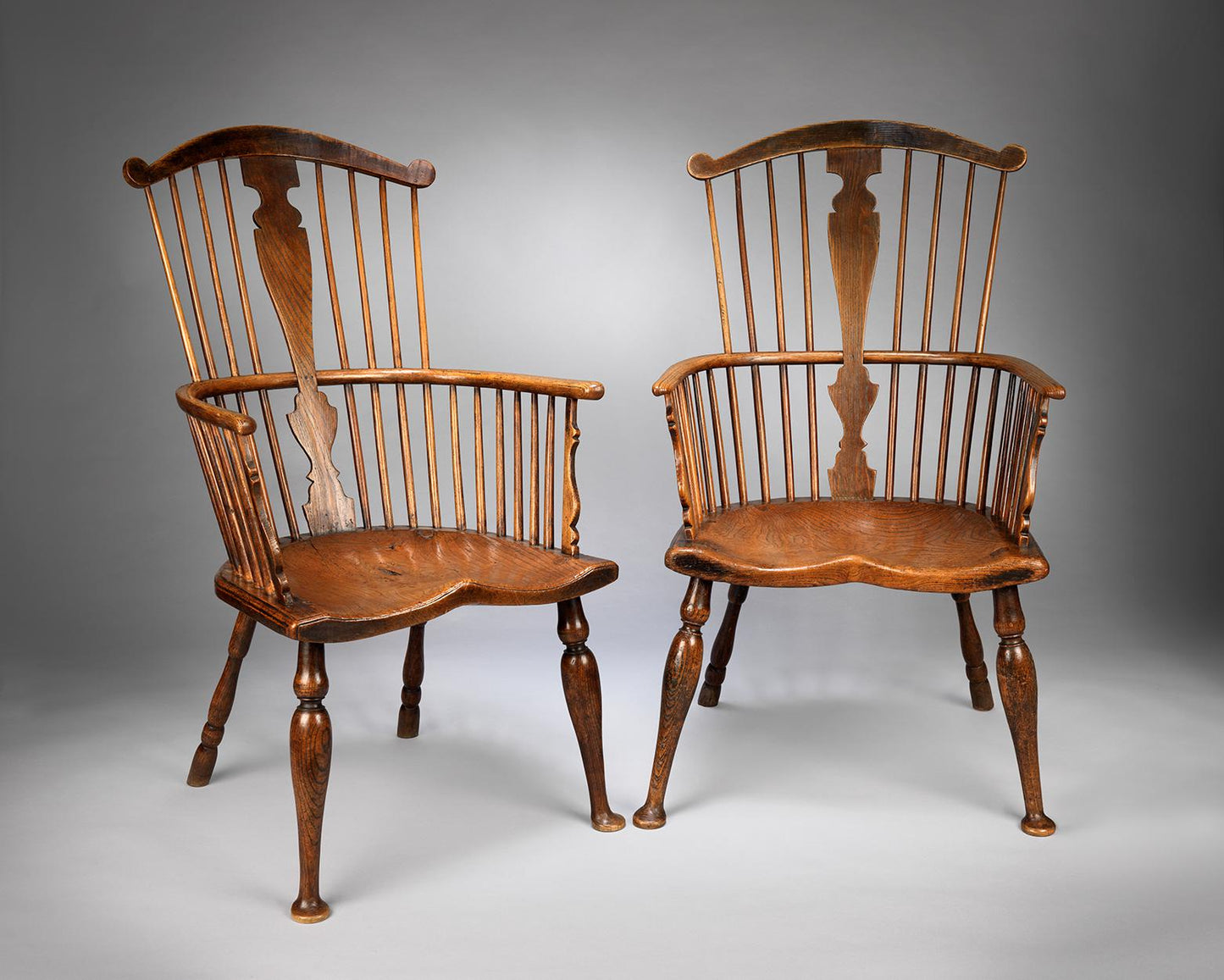 Exceptional Pair of Primitive Georgian Windsor Comb Back Armchairs