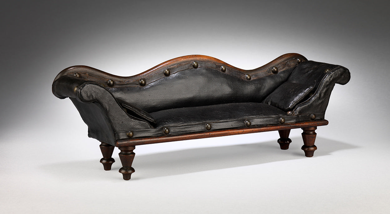 A Rare and Delightful Miniature Scroll Back Sofa