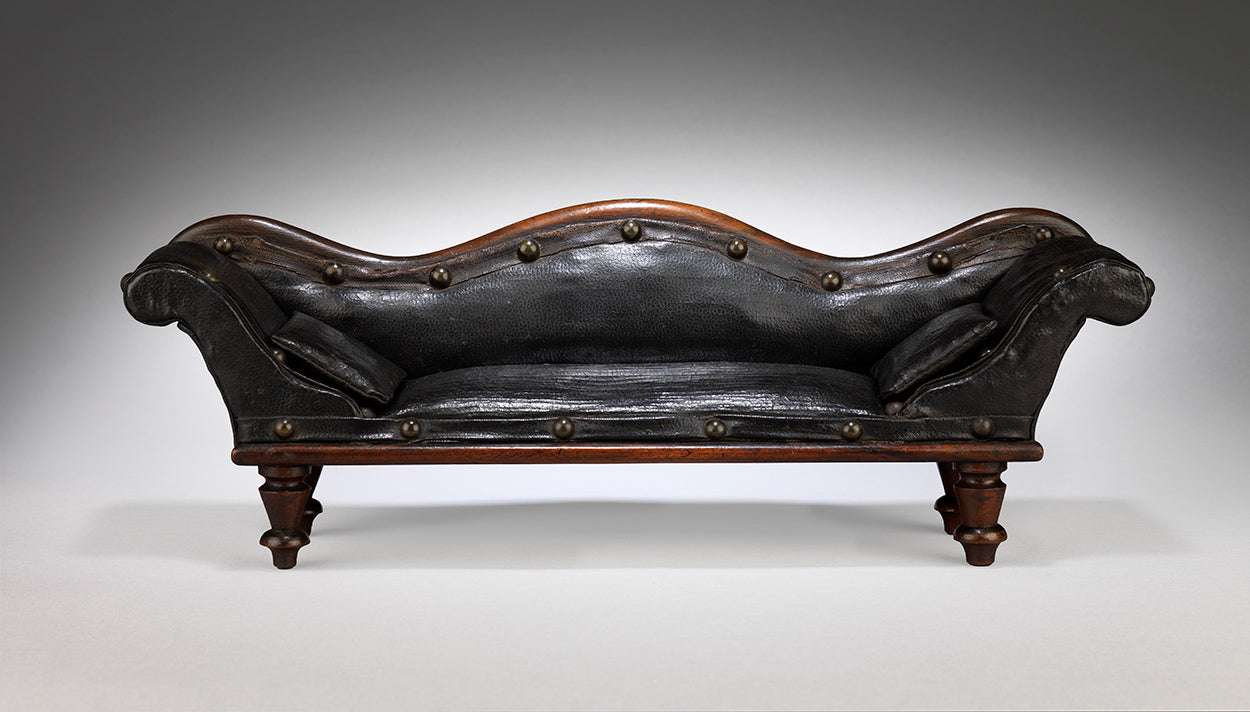 A Rare and Delightful Miniature Scroll Back Sofa