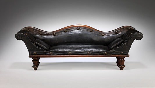 A Rare and Delightful Miniature Scroll Back Sofa