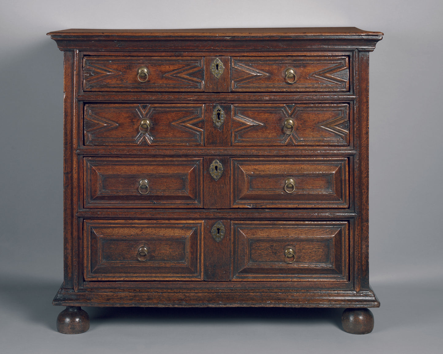 Fine Chest of Geometric and Cushion Moulded Drawers