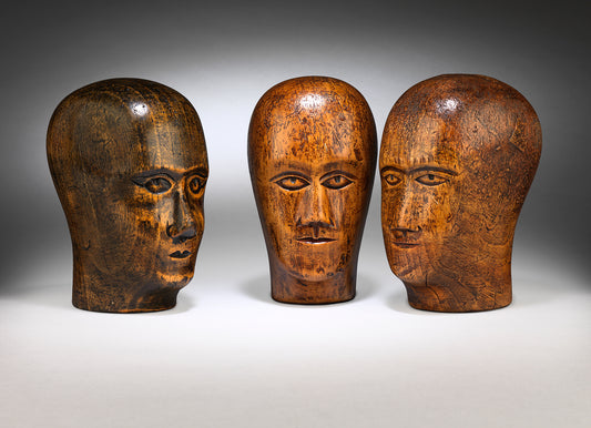 A Group of Three Milliner's Heads