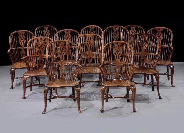 A Harlequin Set of Twelve George III Yew and Elm Cabriole-Leg Windsor Armchairs