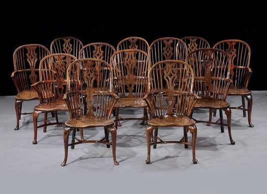 A Harlequin Set of Twelve George III Yew and Elm Cabriole-Leg Windsor Armchairs