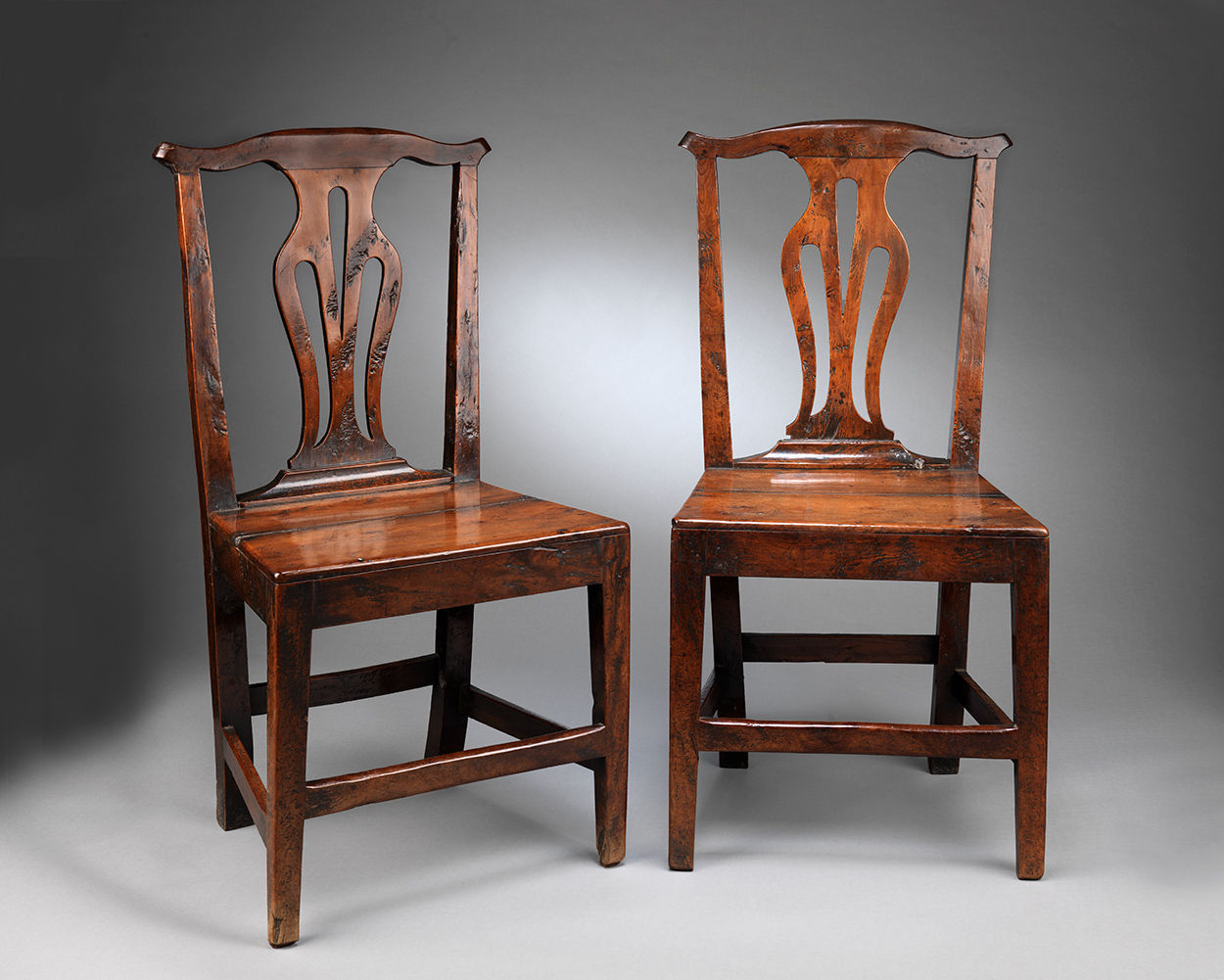 A Rare Pair of "Country Chippendale" Side Chairs