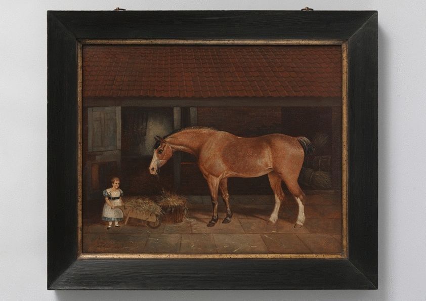 Portrait Of A Child With Wheelbarrow Feeding a Horse