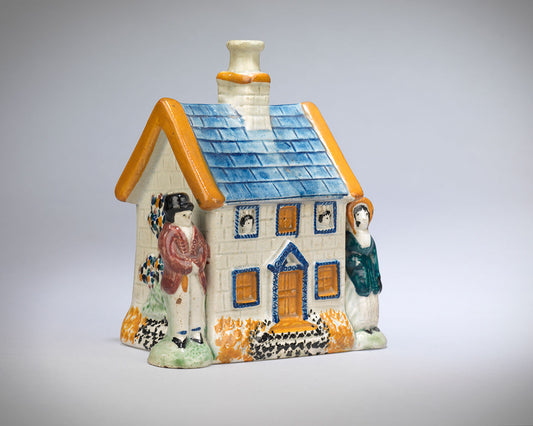 A Delightful Prattware Cottage Money Box