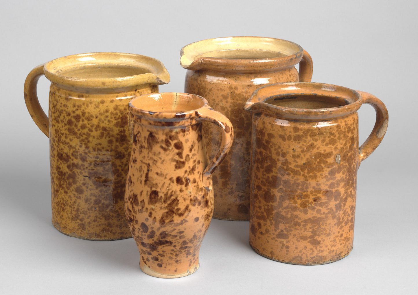 A Collection of Four Splatterglazed Jugs