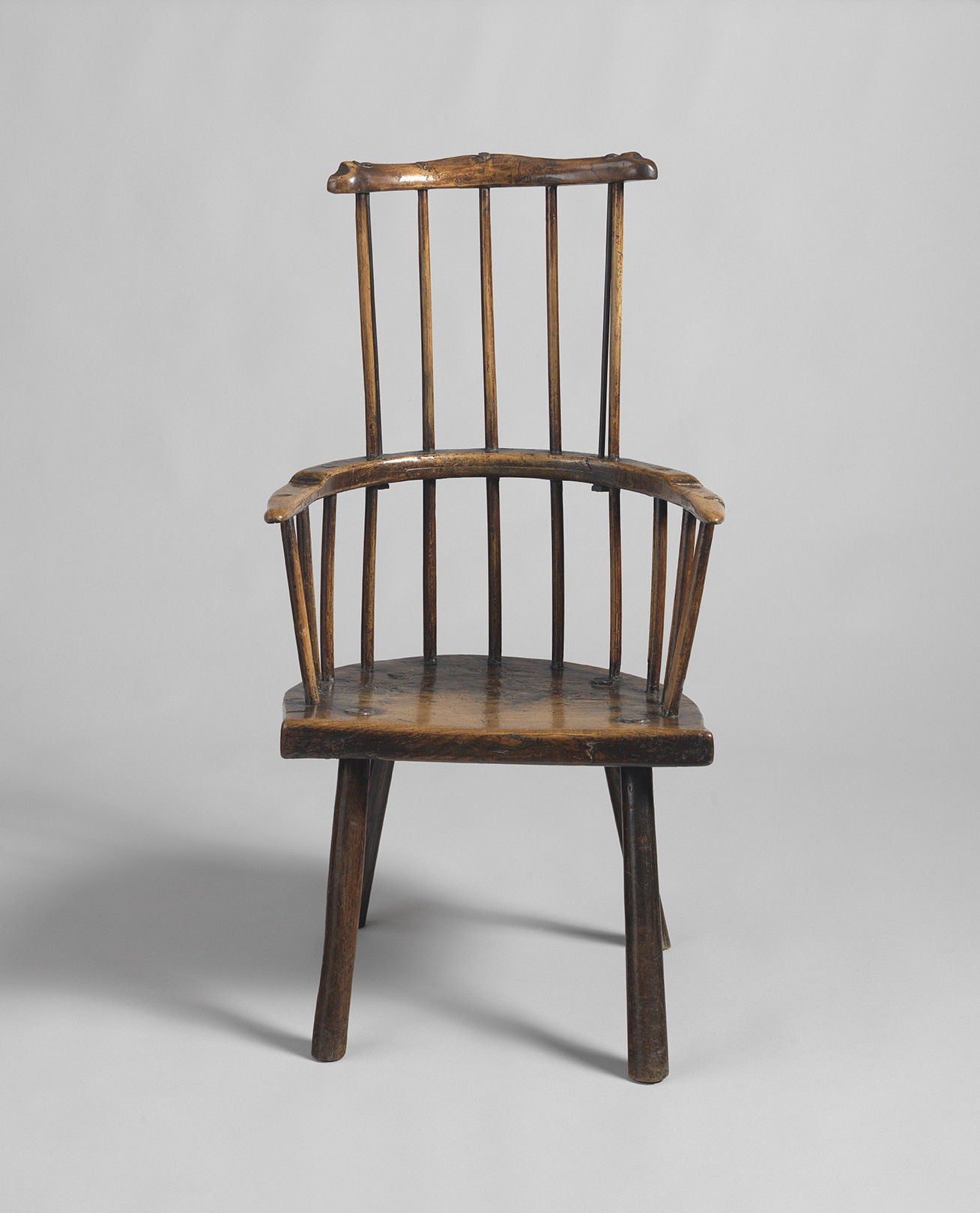 Sculptural Primitive Comb Back Armchair